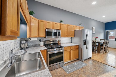 Kitchen featuring sink, backsplash, and stainless 