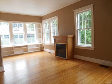 Formal living room with gas fireplace and plenty o