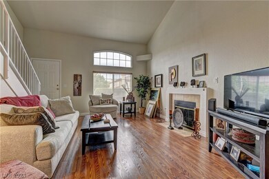 Living room with fireplace. Vaulted ceiling