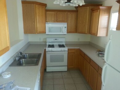 Kitchen offers window view to back/pond/patio door