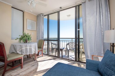 Sunroom / solarium with a water view