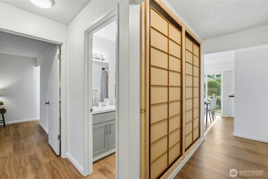 The entry has a custom Shoji door display, luxury vinyl plank flooring throughout.
