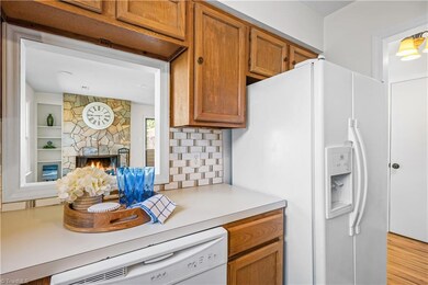 The pass through in the kitchen allows for  the ease of entertainment and creates a more open and connected living space.