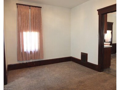 Formal dining room with newer carpet.