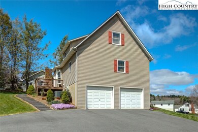 Large parking area with 2 car garage