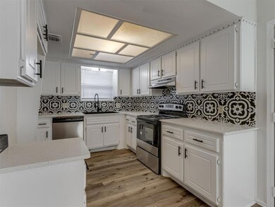 Kitchen featuring range with electric stovetop, li