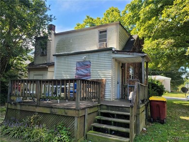 Back of property featuring a deck