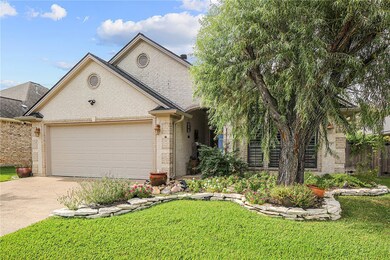 View of front of home featuring a garage and a fro