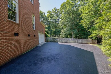 Driveway very recently sealed.  Leads to oversized