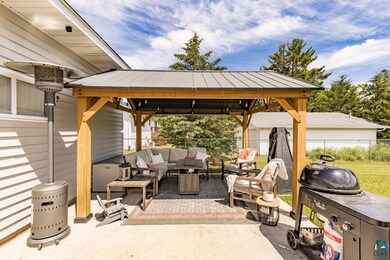 View of patio with an outdoor hangout area, a stor