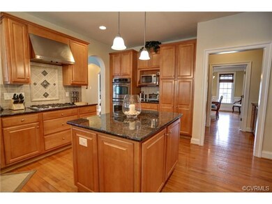 Kitchen has gas cook top with hood, double oven, t