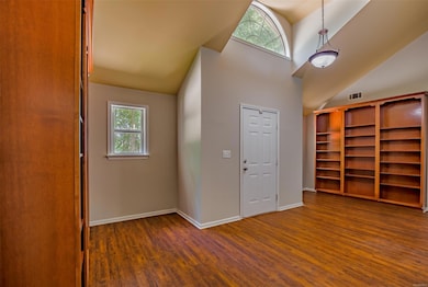 Built in bookshelves and room for a seating area i
