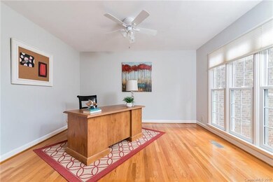 This bright and sunny front room makes a great off