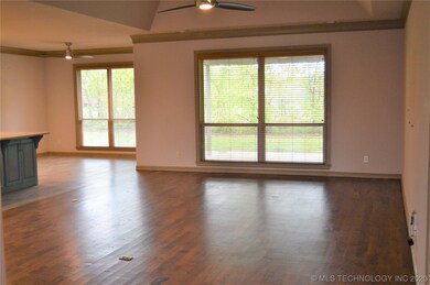Large open living area with vaulted ceilings.