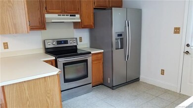 The kitchen features tiled flooring, an upgraded s