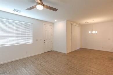 Unfurnished room featuring baseboards, visible ven