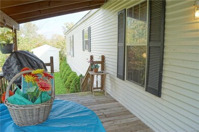 Large, covered deck with ramp entry making it hand