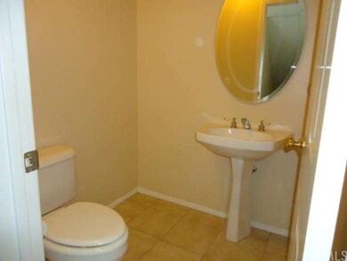 A powder room is conveniently located by the livin