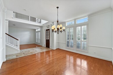 Formal Dining Room showcases beautiful plantation shutters.