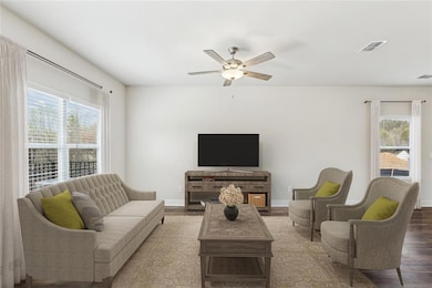 Living room featuring wood-type flooring and ceili