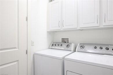 Laundry room with washer and clothes dryer and cab