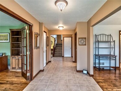 Large foyer with rear staircase.