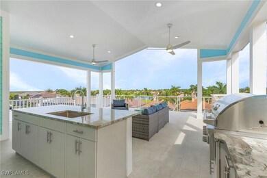 View of covered deck with outdoor kitchen includin