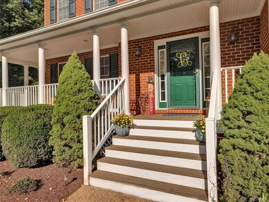 The front country porch wraps around to the side o