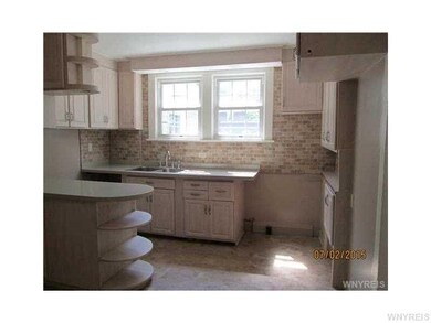 Kitchen. New vinyl flooring and backsplash.