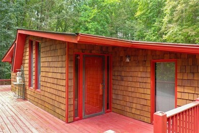 View of outdoor structure with a view of trees