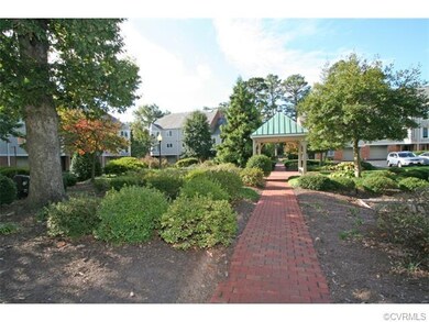 Walk outside your front door to the central courtyard with brick walkways, mature landscaping and parking areas for residents and guests that supplement the garage for each condominium.