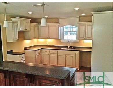 Kitchen. Custom cabinets, breakfast bar, solid sur