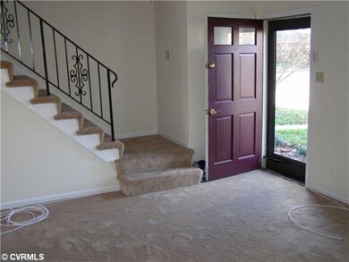Foyer - Entry and iron railed staircase.  Fresh pa