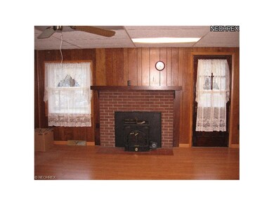 Fireplace with gas insert adds extra warmth to thi