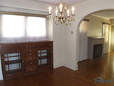 Built-in wood buffet and chandelier