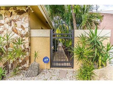 Exterior Front. Aluminum gates with locks.