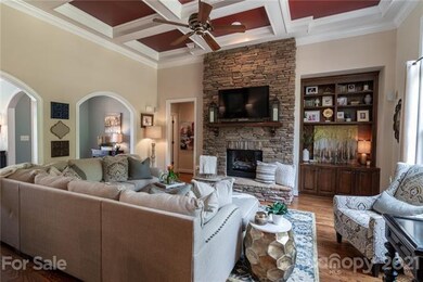 Living Room with Stacked Stone Fireplace and Build