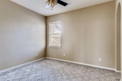 Unfurnished room with carpet floors, a ceiling fa