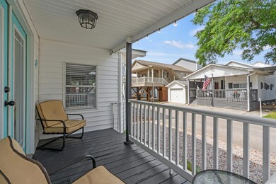 Wooden porch with an outbuilding and a residential view