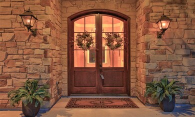 Sunset view of the front door. Welcome your guest in style to this simply gorgeous house!