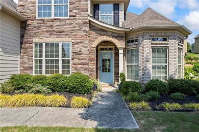 Property entrance featuring stone siding