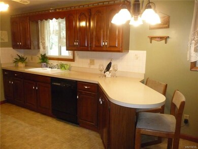 Updated kitchen with ample cabinetry and counters,