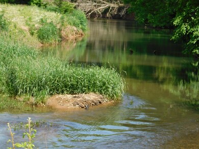 BORDERED BY RED RIVER