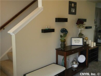 Foyer. The foyer features an open staircase, and .
