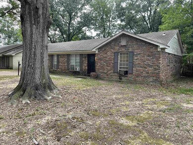 Ranch-style house with cooling unit