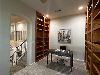 Study on Landing...plenty of built-in book shelves and natural light. sitting area.