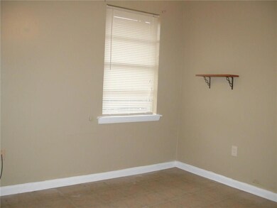 Bedroom with tile floors.