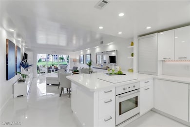 Kitchen featuring white oven, modern cabinets, a p