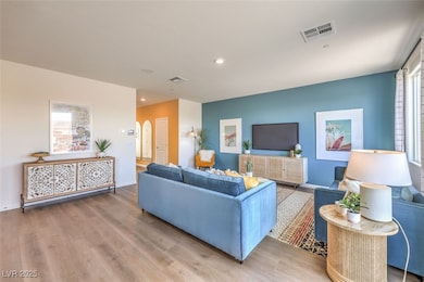 Living room featuring arched walkways, baseboards,