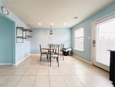 Dining area featuring baseboards, recessed lighti